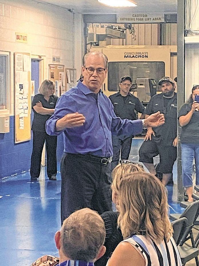 Sen. Mike Braun speaks with workers at Decatur Plastic Products in North Vernon on Tuesday morning.